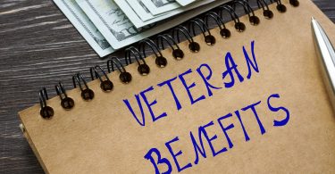 Financial concept meaning VETERAN BENEFITS with inscription on t