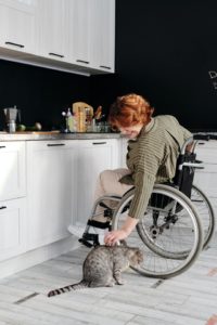 disabled woman in wheel chair with cat