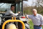 father and son working vineyard