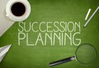 Succession planning concept on blackboard